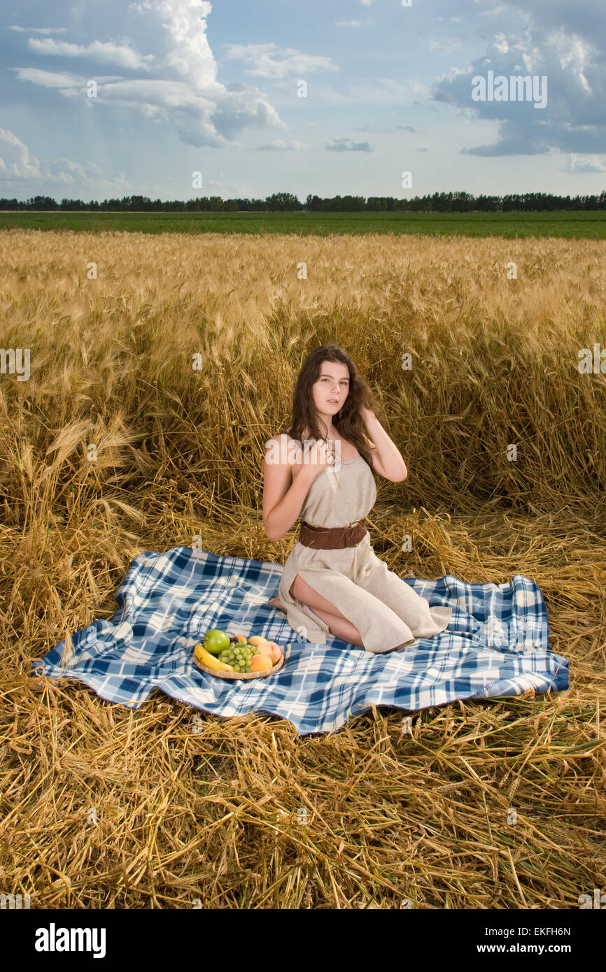 Beautiful slavonic girl on picnic in wheat field with fruits Stock ...