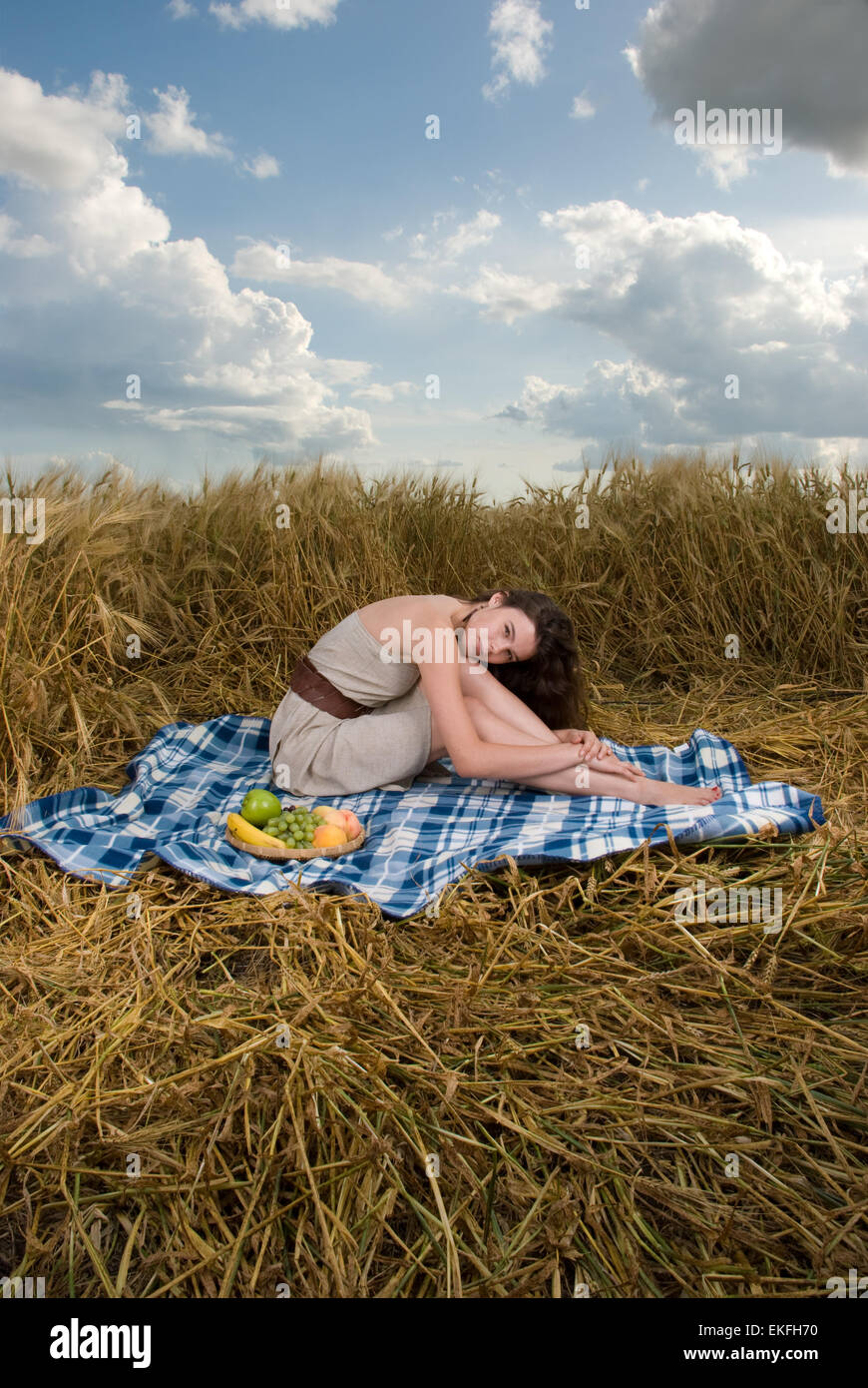 Beautiful slavonic girl on picnic in wheat field Stock Photo - Alamy