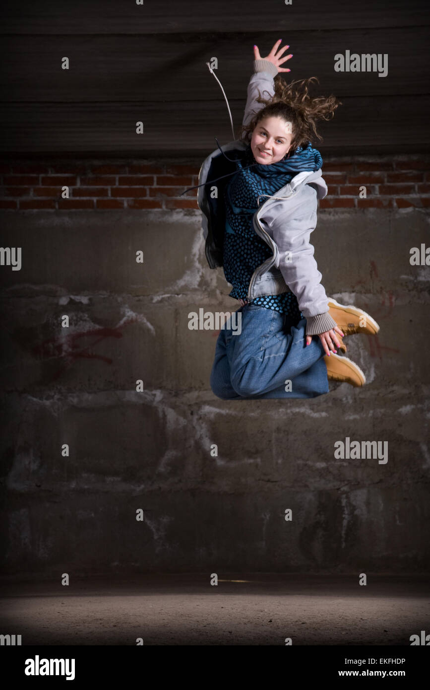 Hip hop dancer in modern style over brick wall Stock Photo