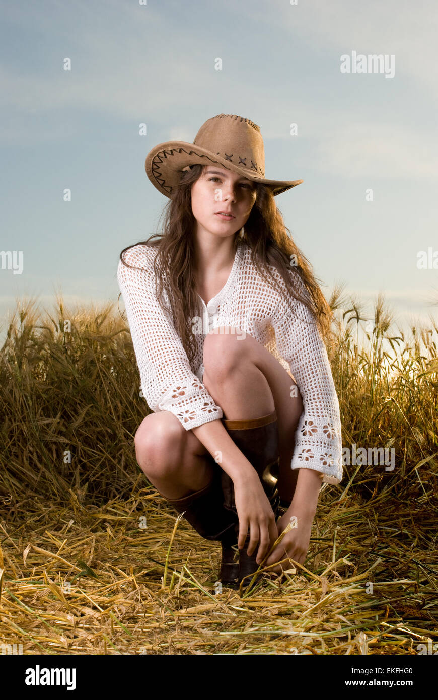 Beautiful slavonic girl in cowboy clothes pose in wheat field Stock ...