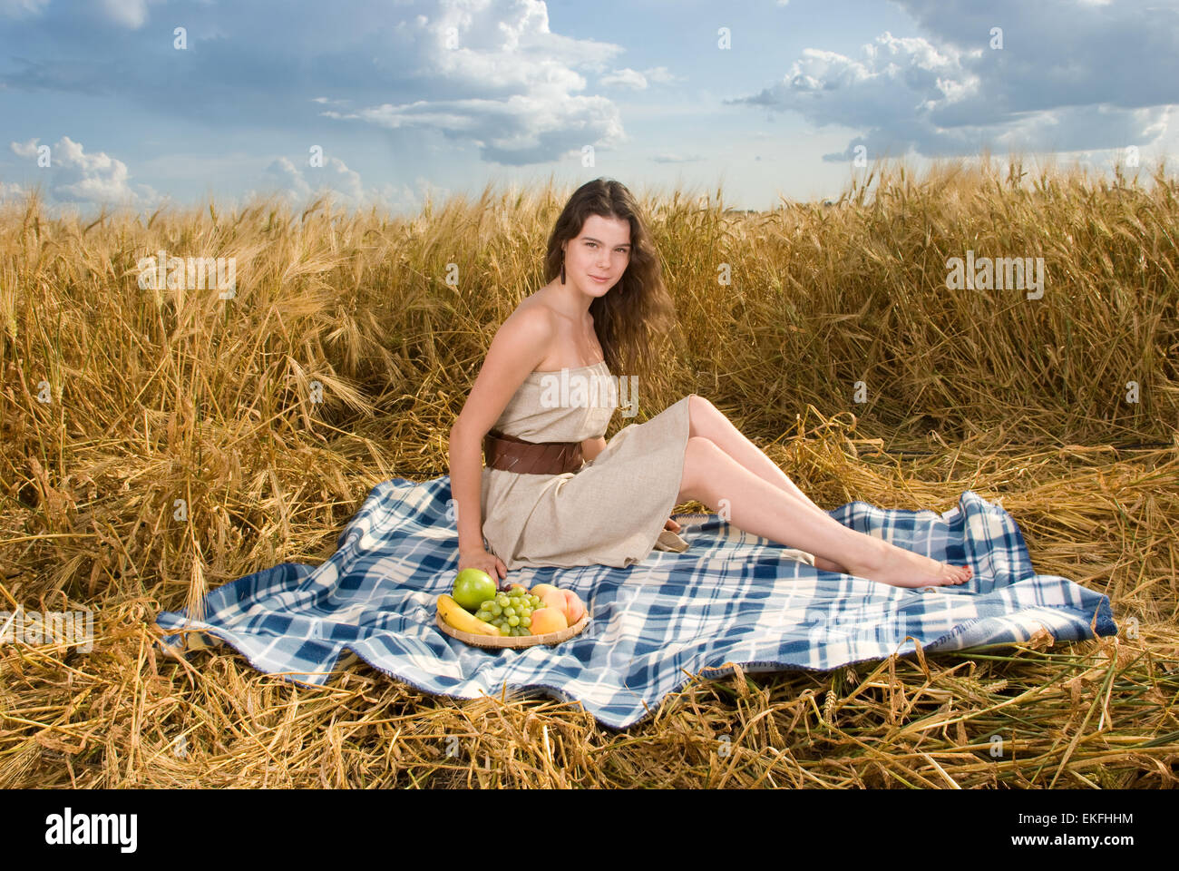 Beautiful slavonic girl on picnic in wheat field Stock Photo - Alamy