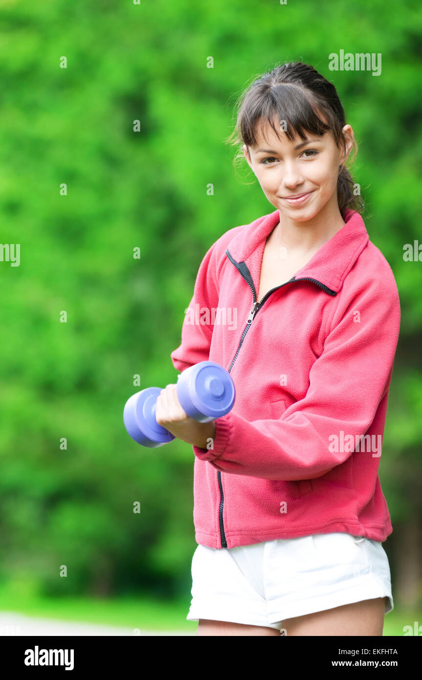 Girl doing dumbbell exercise outdoor Stock Photo Alamy