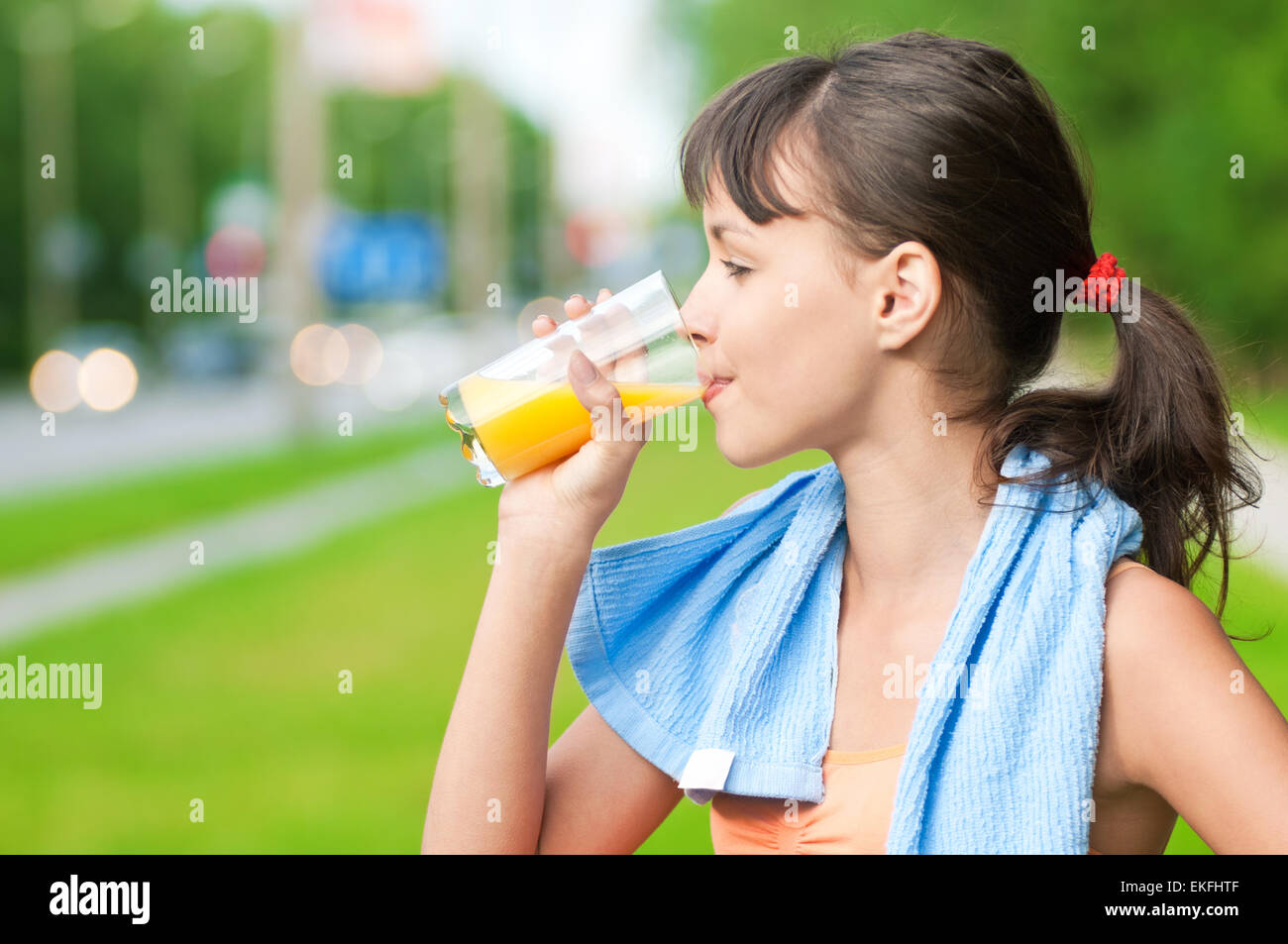 Girl drinking juice after exercise Stock Photo Alamy