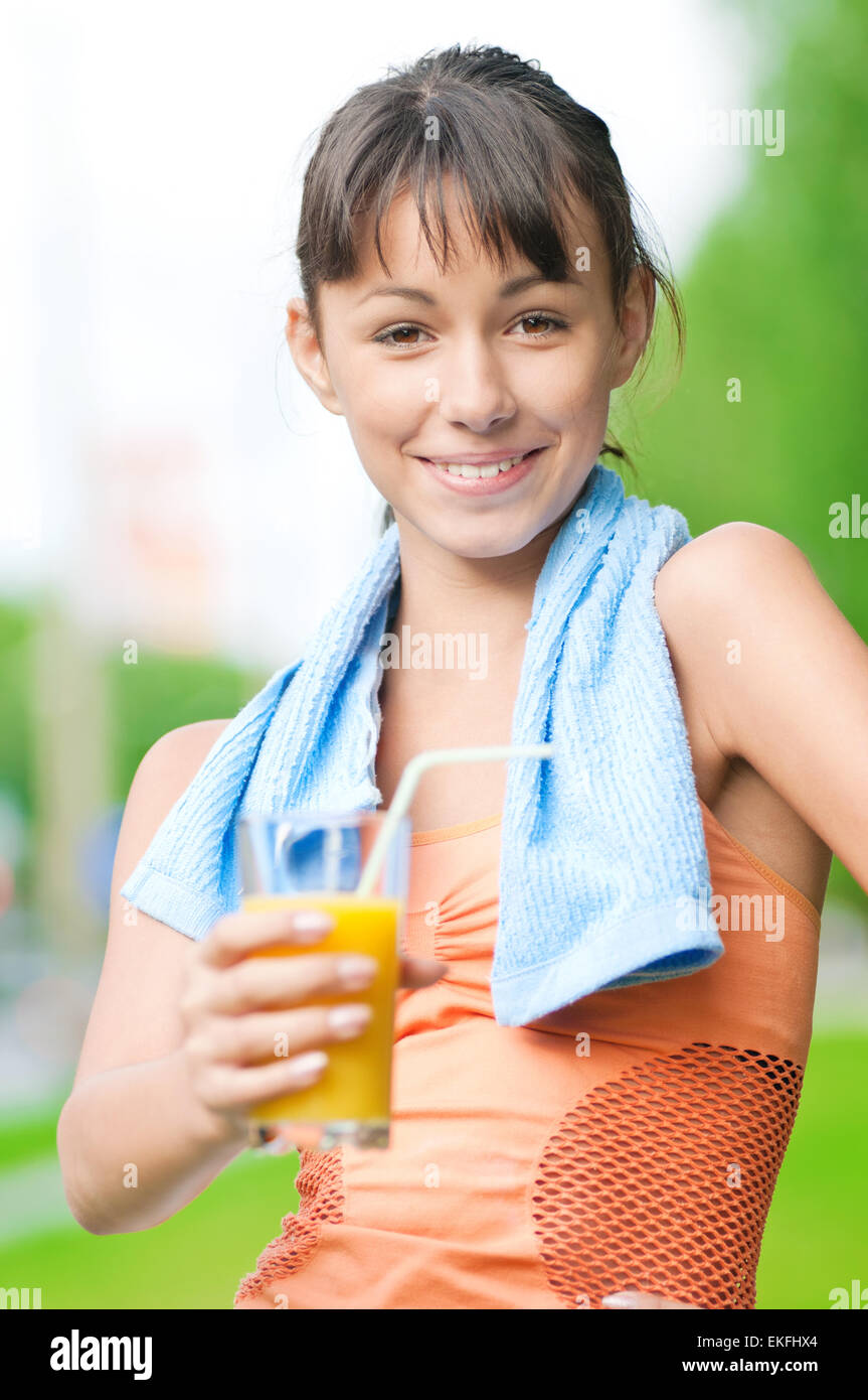 Girl drinking juice after exercise Stock Photo Alamy