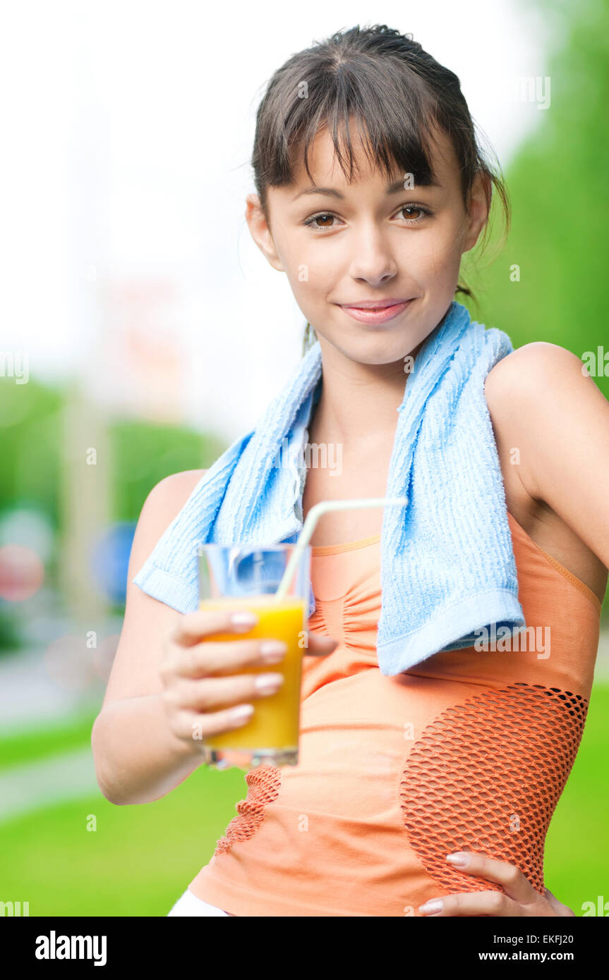 Girl drinking juice after exercise Stock Photo Alamy