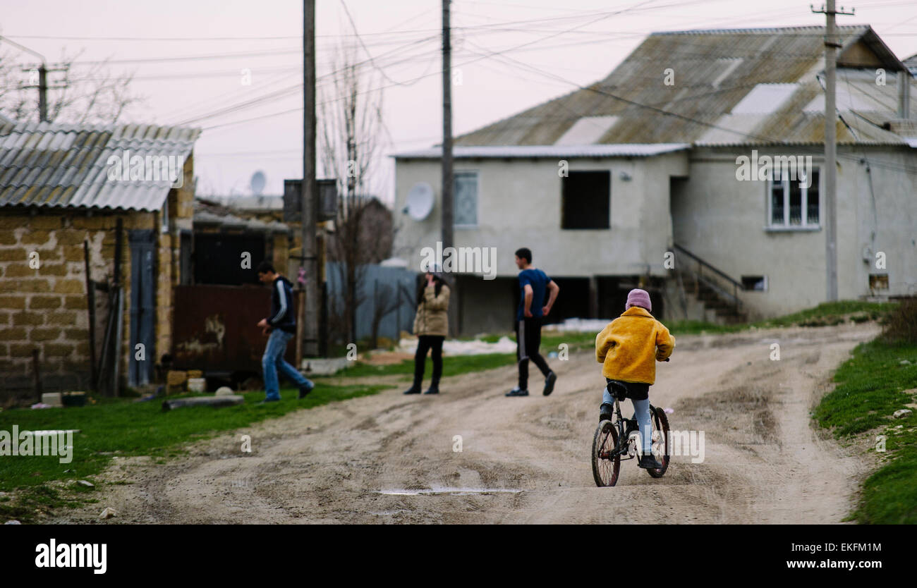 Bakhchysara, Ukraine. 06th Mar, 2015. Four children play on the street in the commune 'No. 6' on the peninsula of the Autonomous Republic of Crimea in the city of Bakhchysara, Ukraine, 06 March 2015. Around 600 Crimean Tatars live in the commune. Photo: Gregor Fischer/dpa - NO WIRE SERVICE -/dpa/Alamy Live News Stock Photo