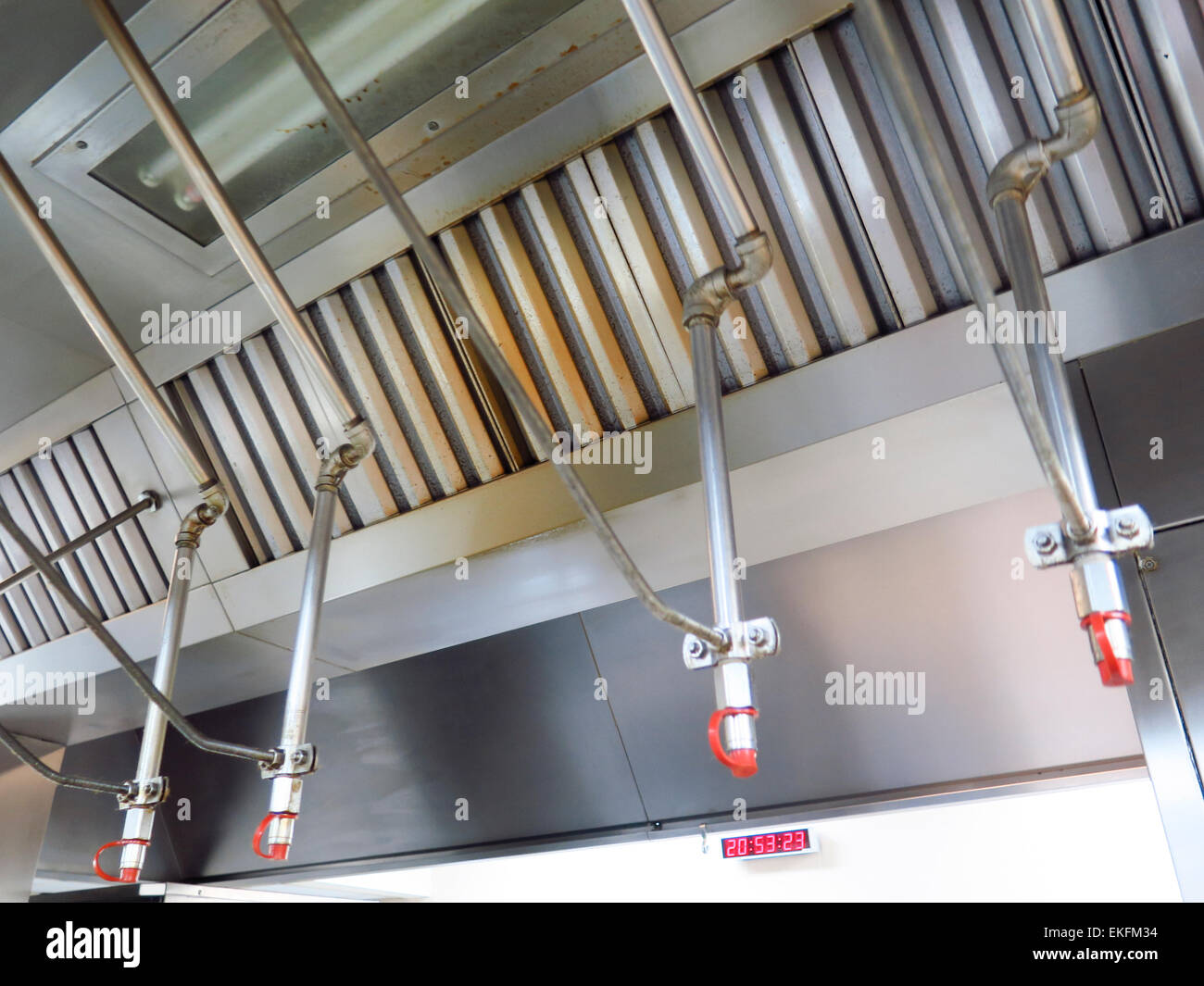 Fire suppression and filters in cooker hood Stock Photo