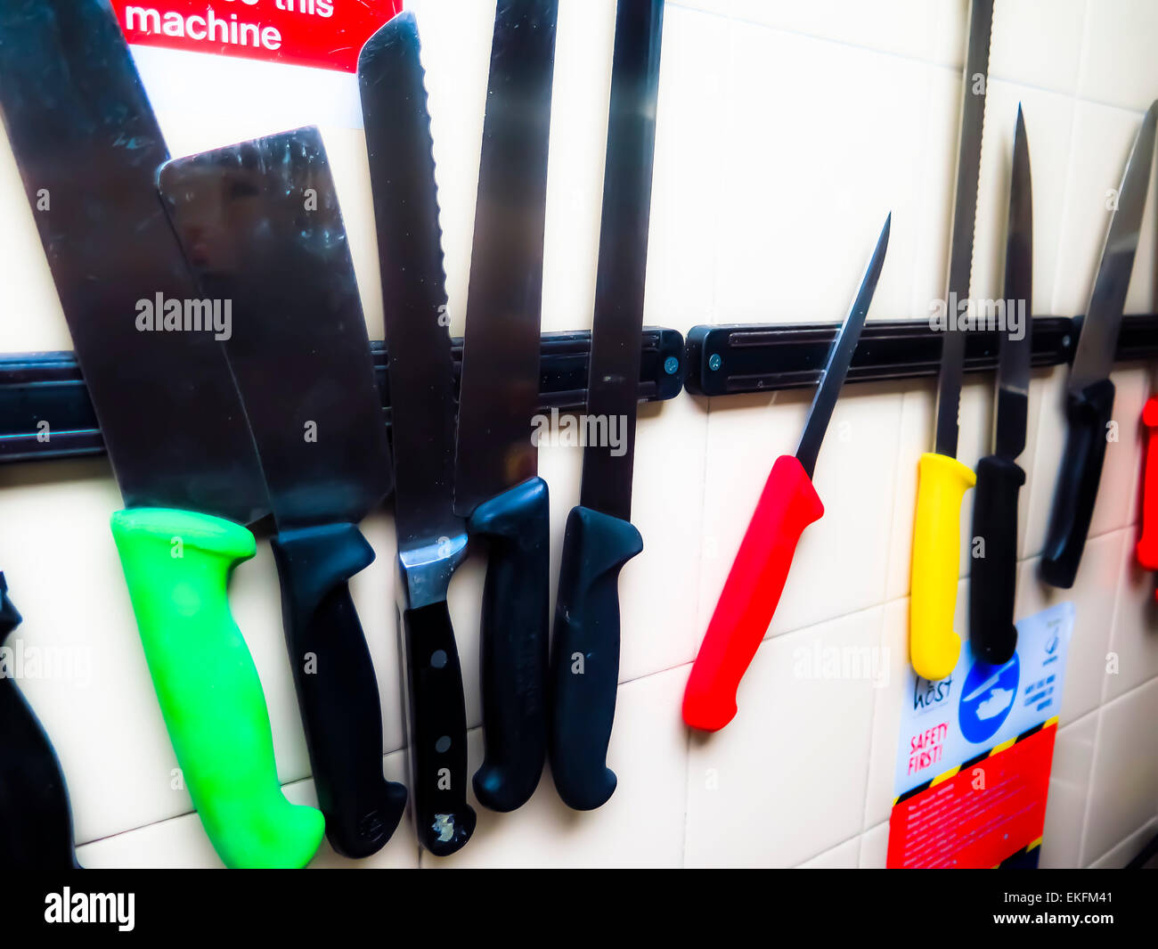 Kitchen knives on magnetic rack Stock Photo