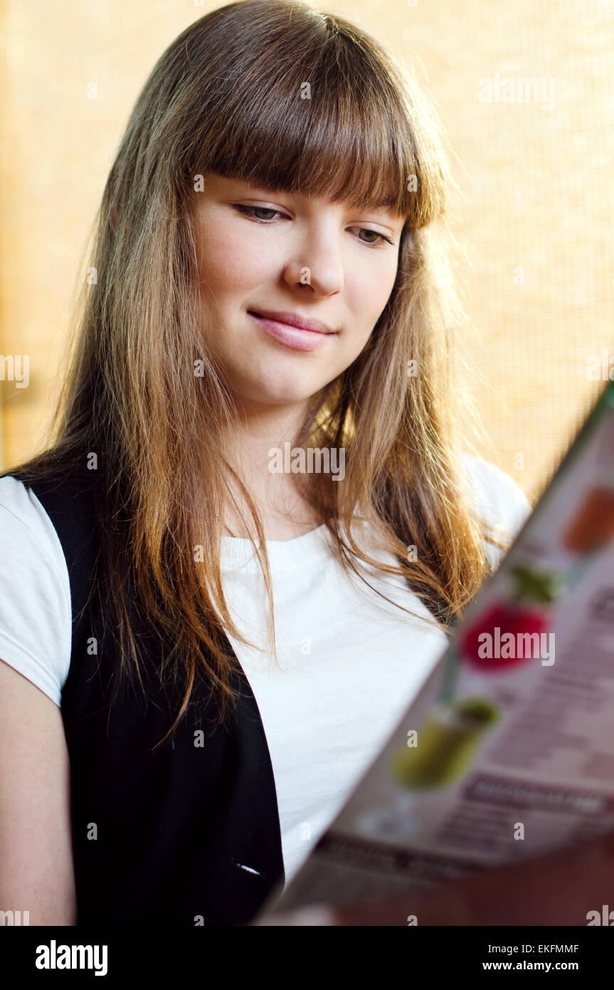 A young woman in a cafe Stock Photo - Alamy