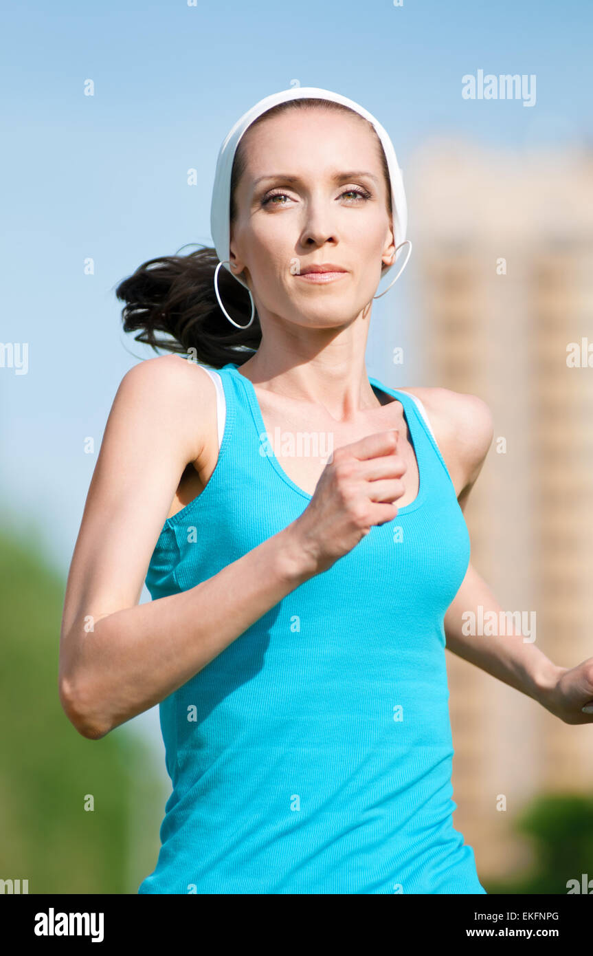 Beautiful woman running in green park Stock Photo Alamy