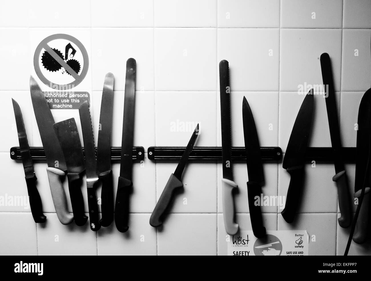 Kitchen knives on magnetic rack Stock Photo