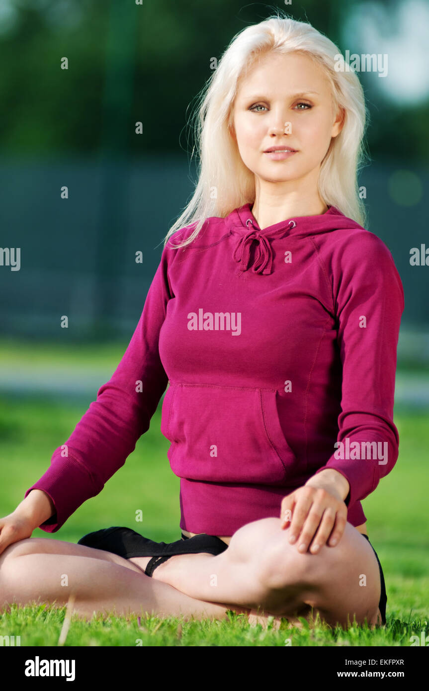 Beautiful woman doing yoga stretching exercise Stock Photo - Alamy