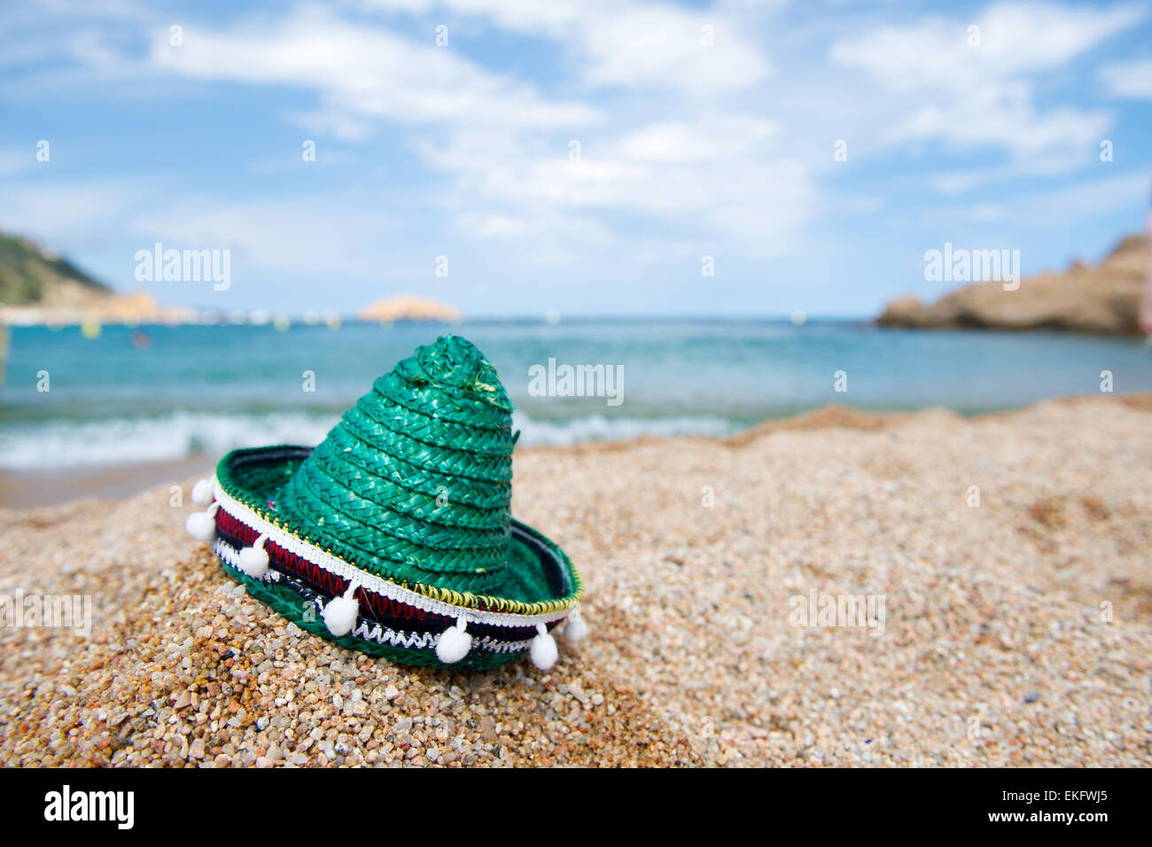 Green Spanish straw hat at beach Stock Photo Alamy