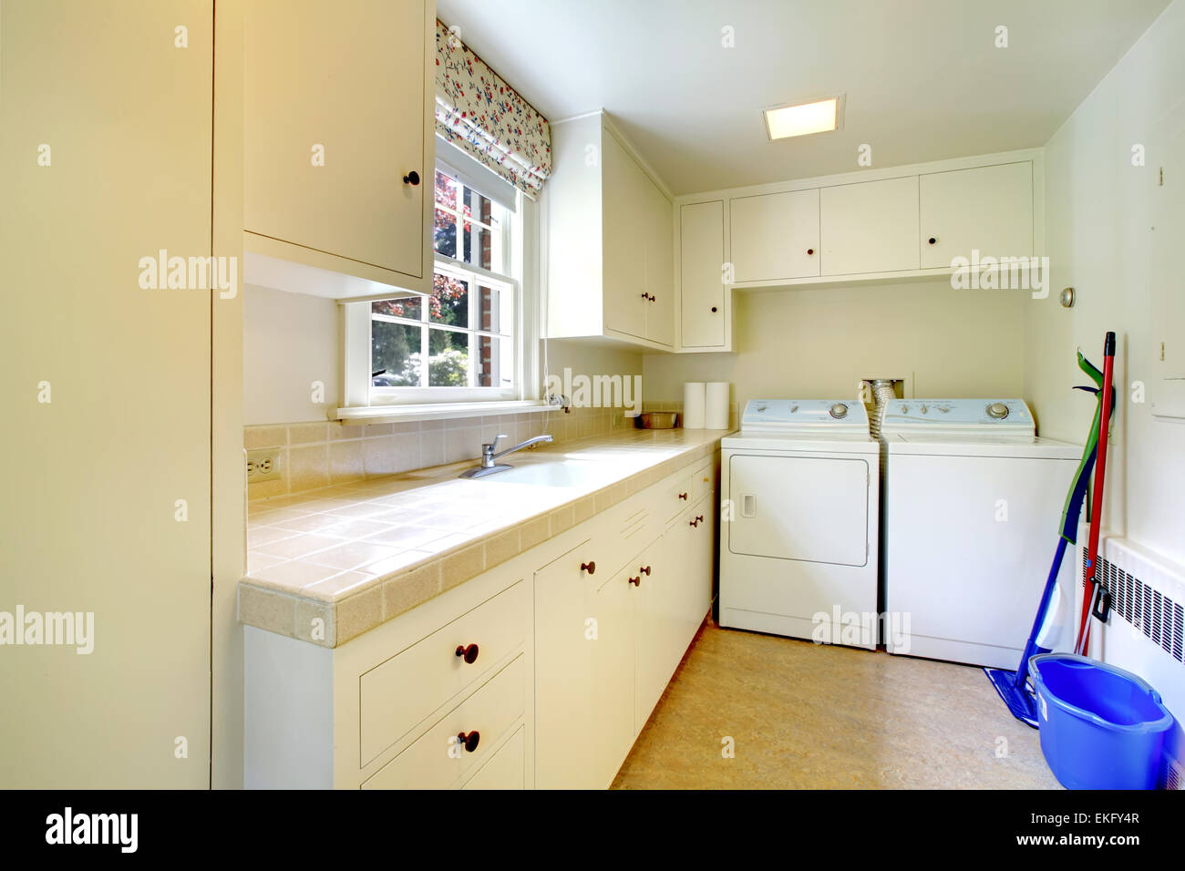 Laundry Room With White Old Cabinets In Large Historical