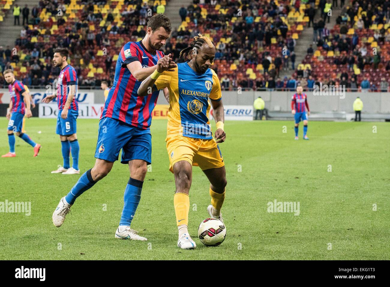 April 9, 2015: Gabriel Tamas #30 of FCSB and Mohamed Tchite #10 of Petrolul Ploiesti in action during the Liga I game between FC Steaua Bucharest ROU and FC Petrolul Ploiesti ROU at National Arena, Romania ROU. Catalin Soare/www.sportaction.ro Stock Photo