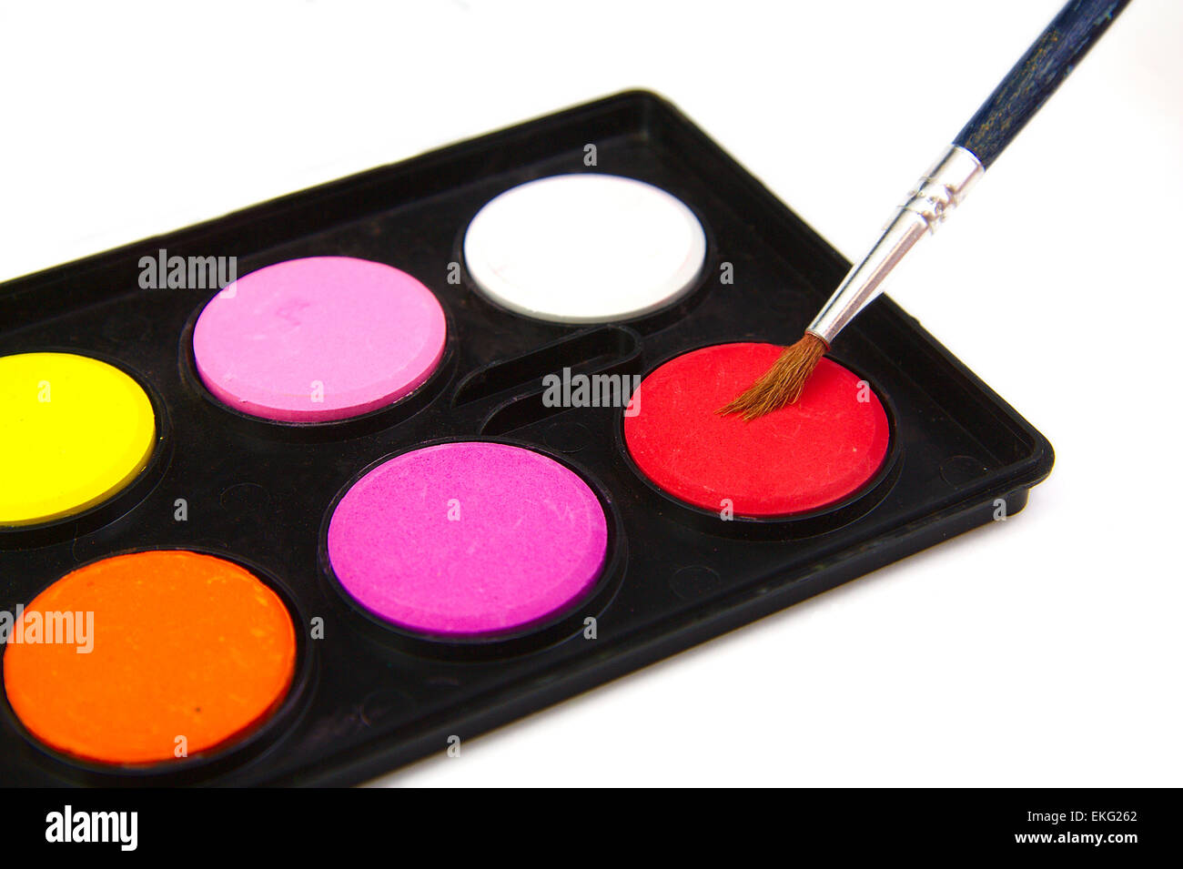 Watercolor red paint and brush on white background Stock Photo - Alamy