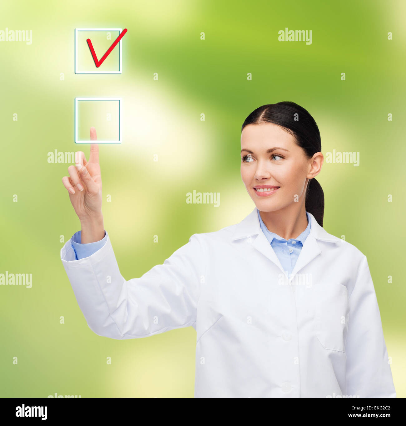 smiling female doctor pointing to checkbox Stock Photo - Alamy