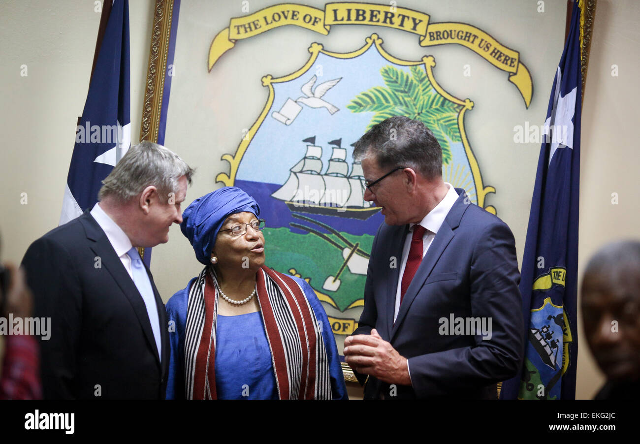 German Federal Minister of Health Hermann Groehe (L) and Minister of Development Gerd Mueller are received by the President of the Republic of Liberia, Ellen Johnson Sirleaf, in Monrovia, Liberia, 10 April 2015. The topic of talks is reconstruction after the Ebola epidemic. Photo: KAY NIETFELD/dpa Stock Photo
