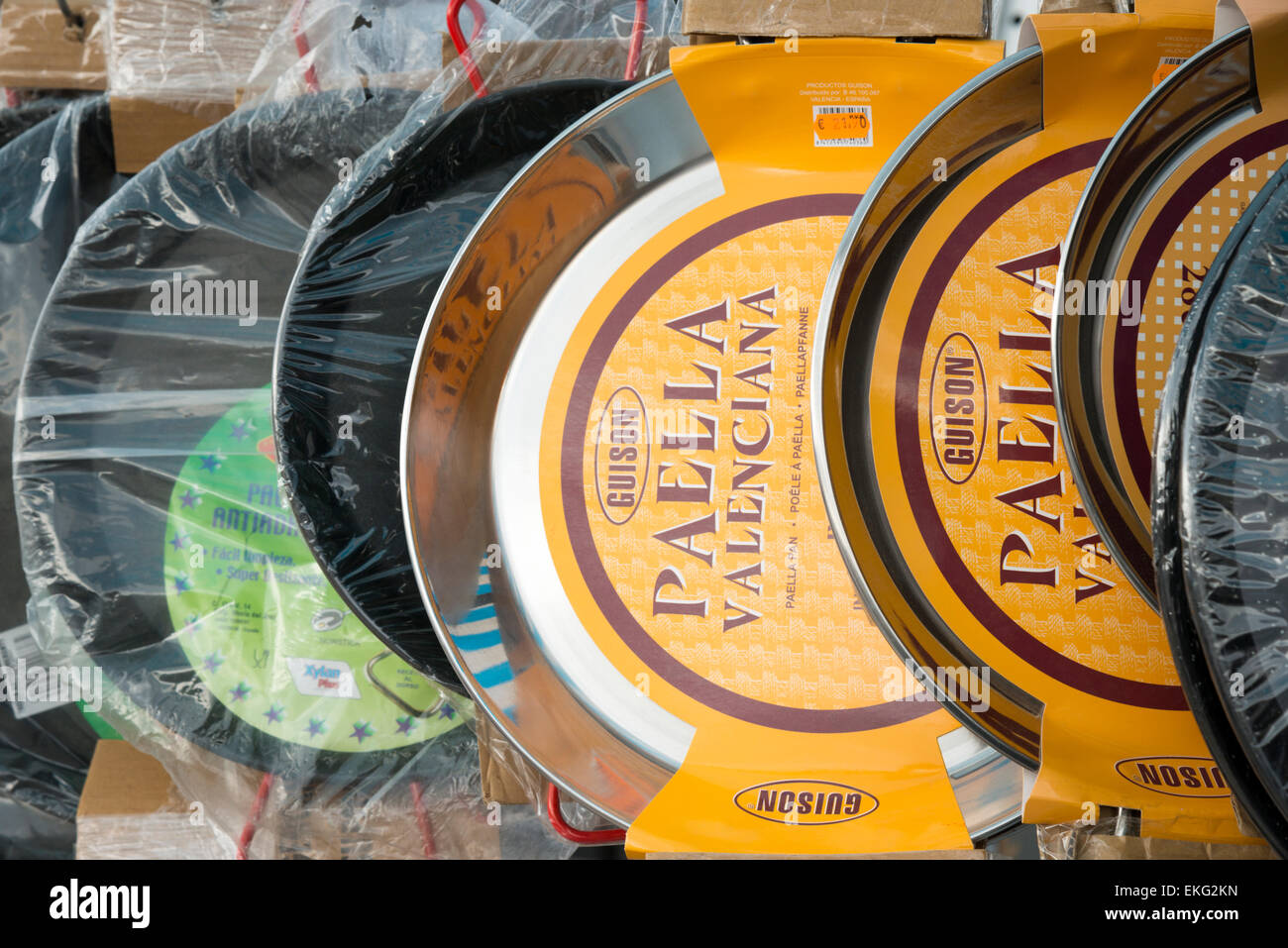 Paella valenciana pans hanging up for sale in a market in Moriara Spain Stock Photo