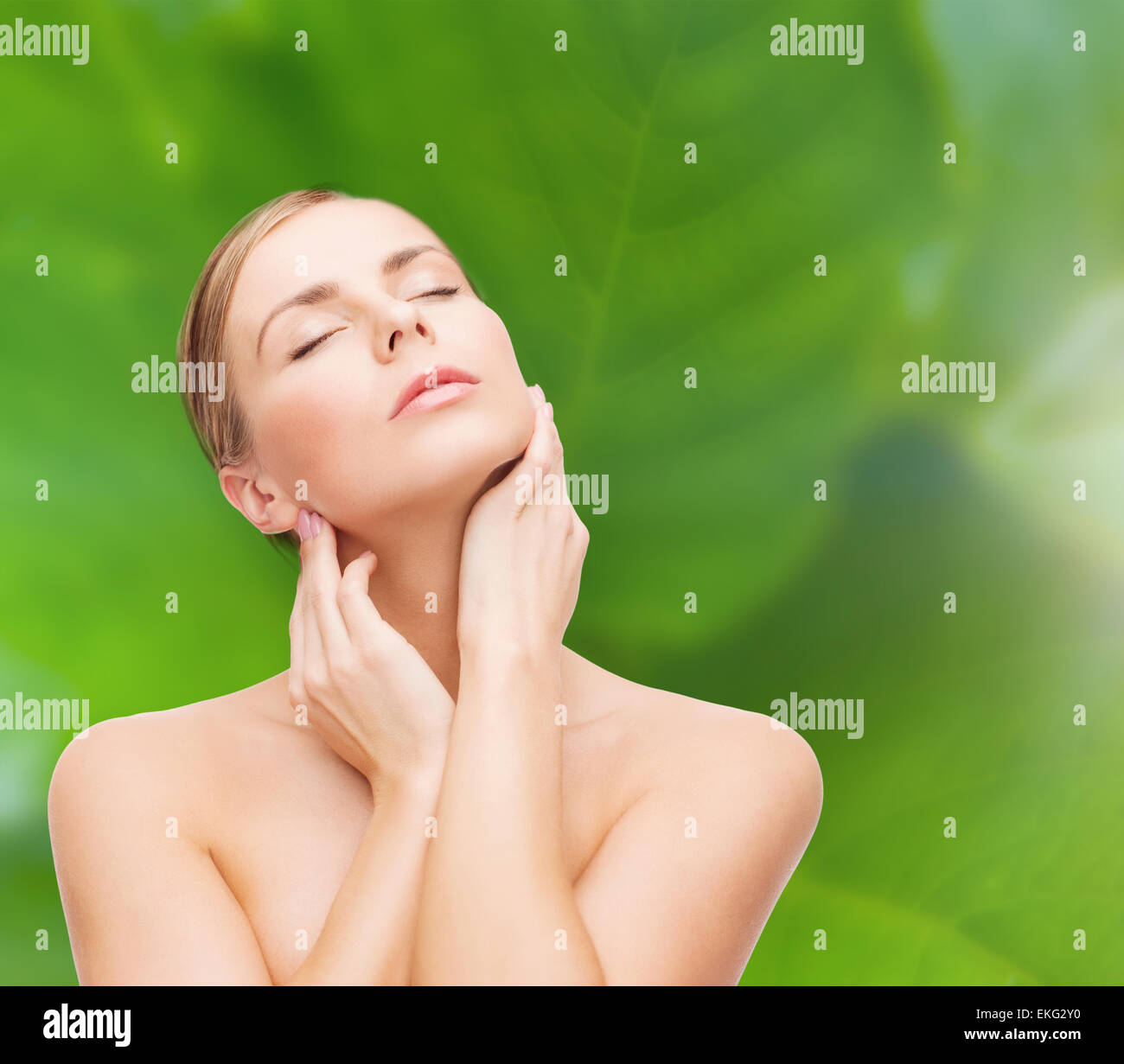 beautiful woman touching her face with closed eyes Stock Photo - Alamy