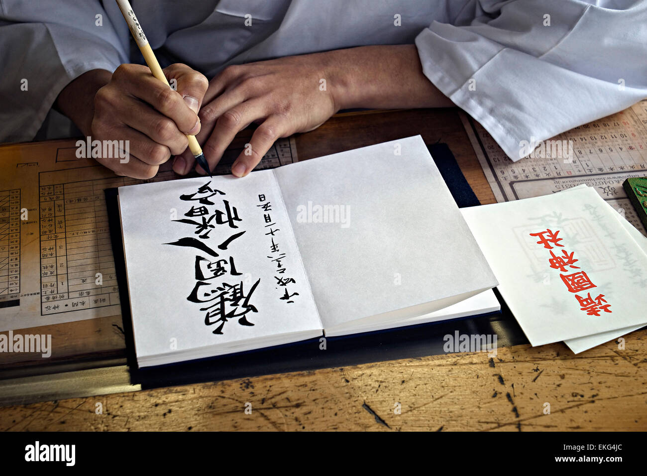 Japan, Honshu island, Kanto, Tokyo, monk making a calligraphy. Stock Photo