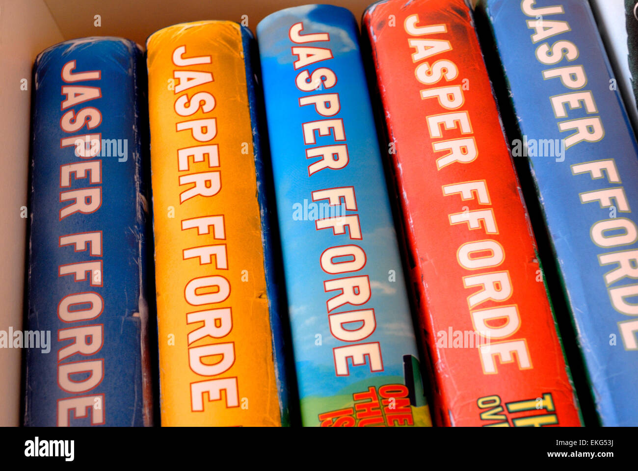 Hardback Jasper Fforde books on a bookshelf Stock Photo