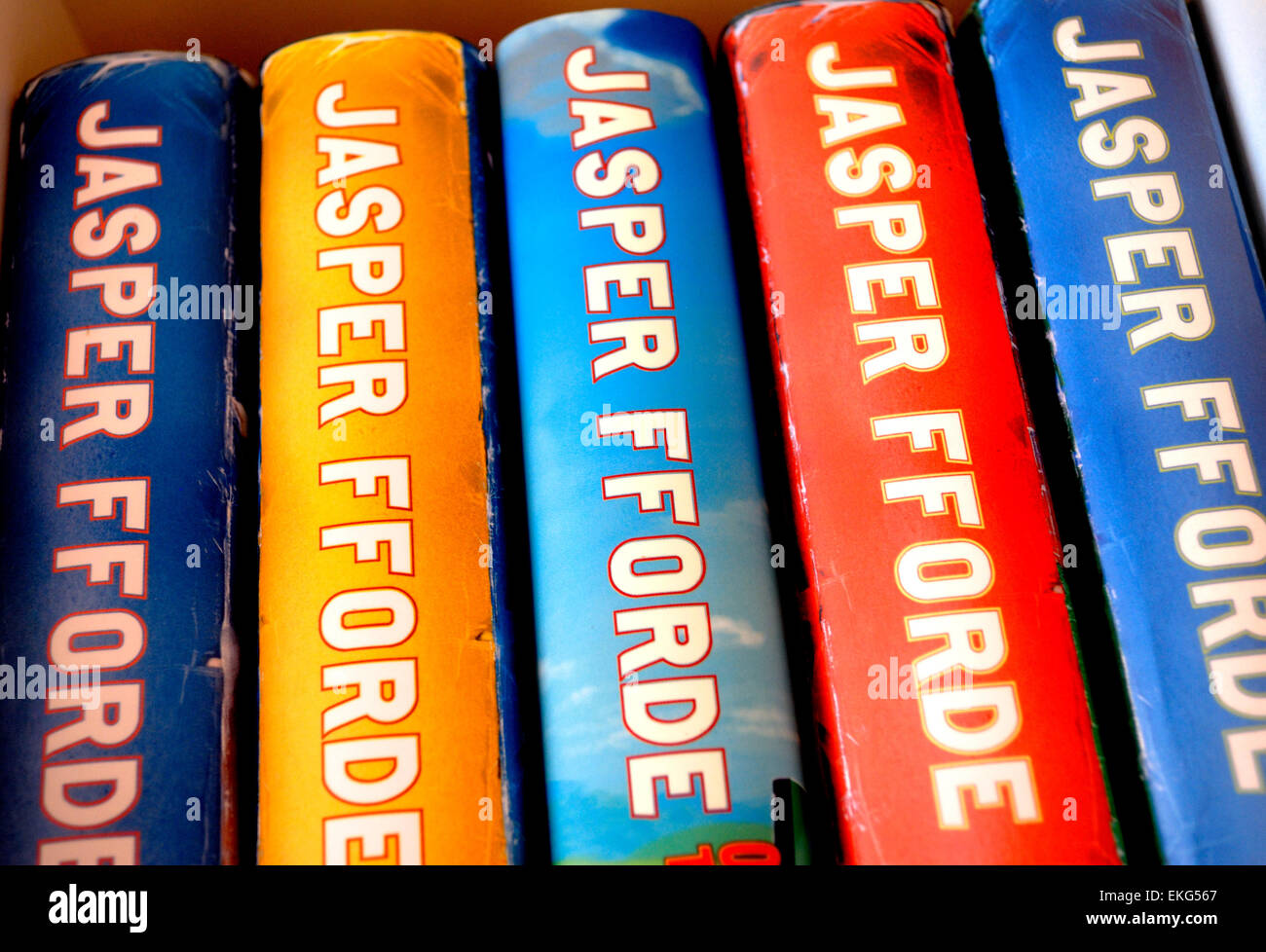 Hardback Jasper Fforde books on a bookshelf Stock Photo