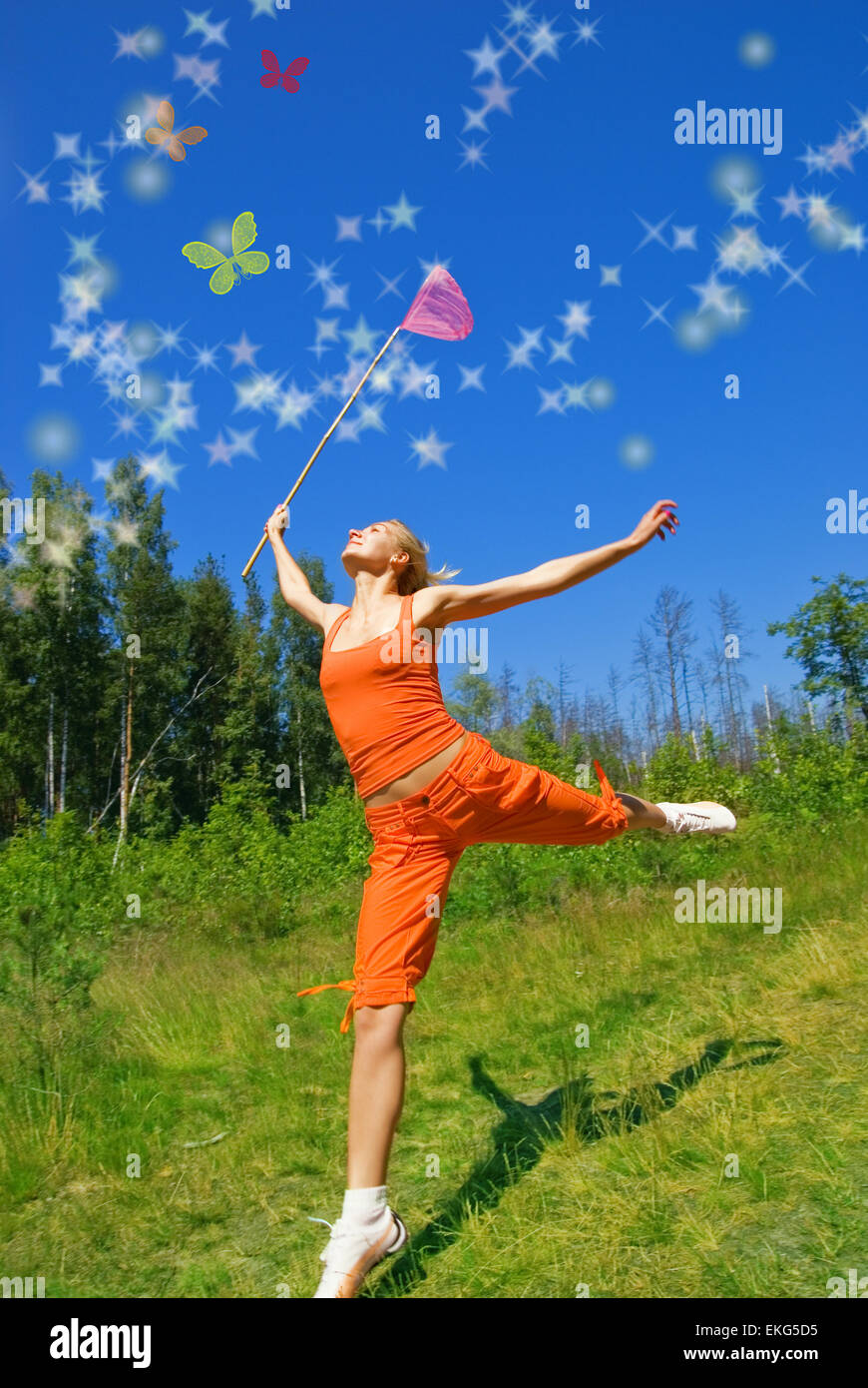 Beautiful girl with a net in her hand trying to catch magic