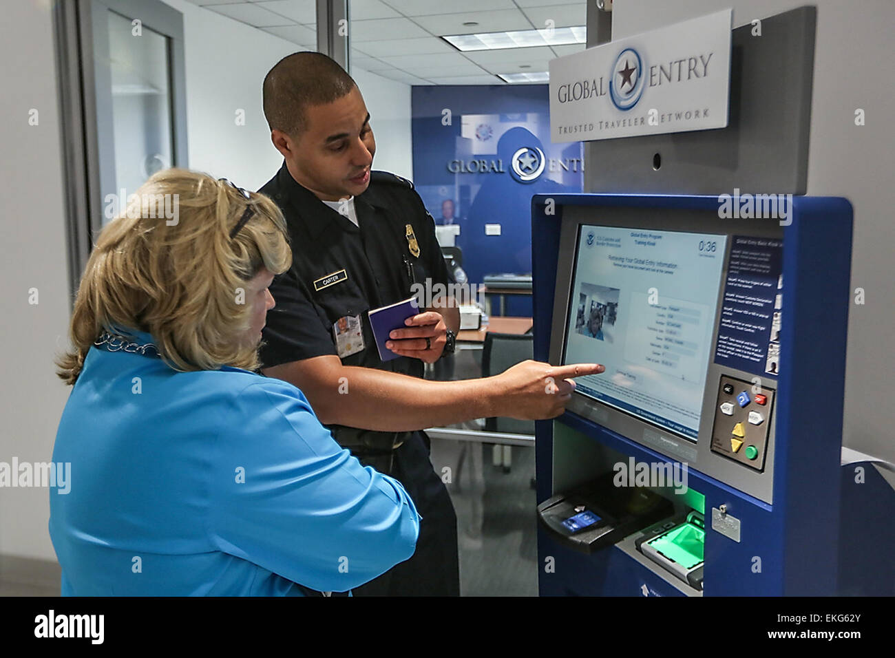 061813: Washington, DC - A CBP officer provides training to an enrollee ...