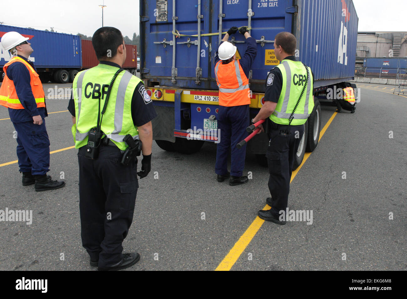 US Customs and Border Protection Field Officers conduct inspection of