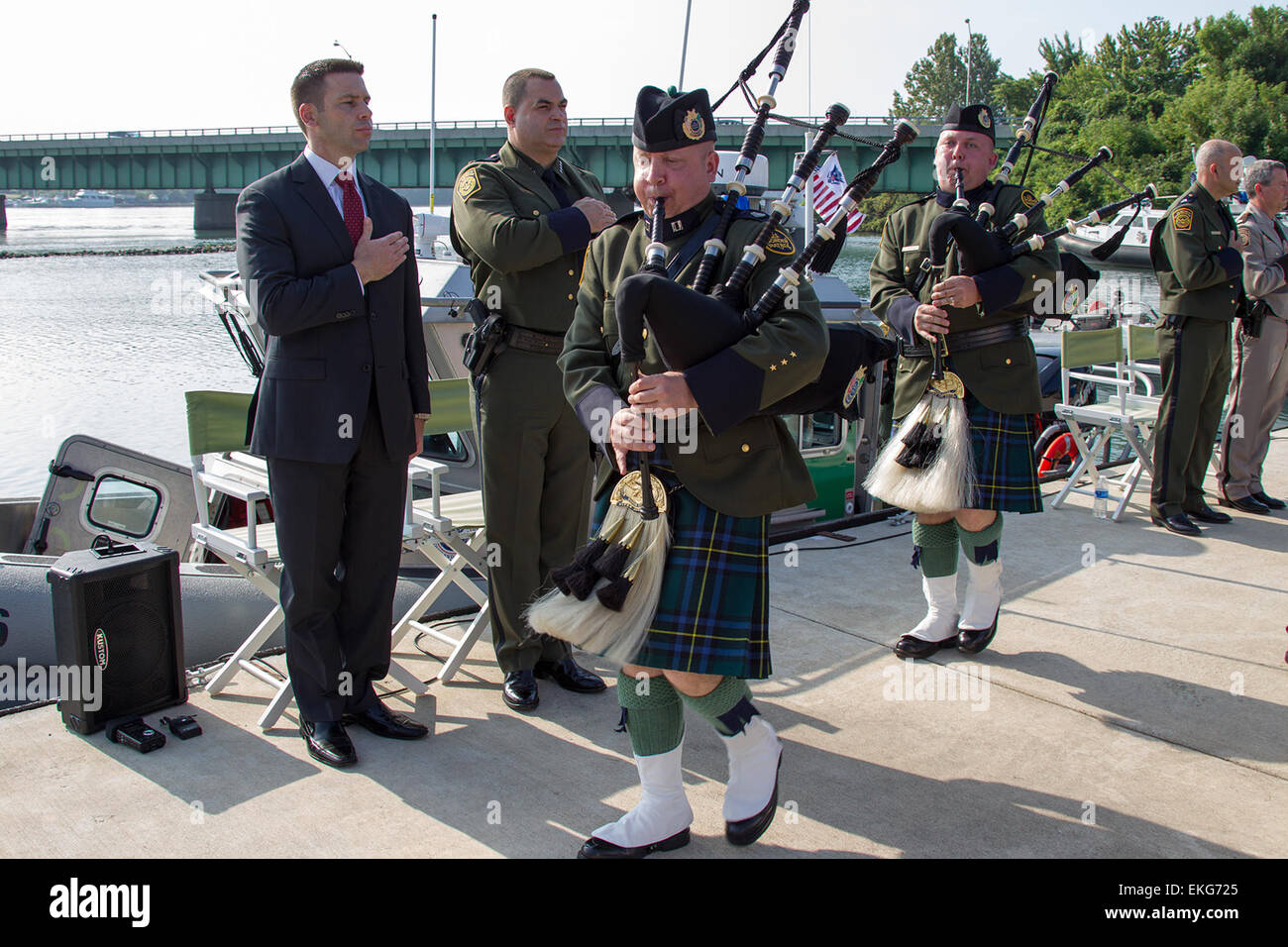 082913: U.S. Customs and Border Protection in honor and remembrance of fallen Border Patrol Agent Brian A. Terry held a CBP Vessel Dedication ceremony at the Elizabeth Park Marina, Trenton, MI.  Seen here are CBP Acting Deputy Commissioner Kevin McAleenan and Border Patrol Chief Michael Fisher during the National Anthem.  Donna Burton Stock Photo