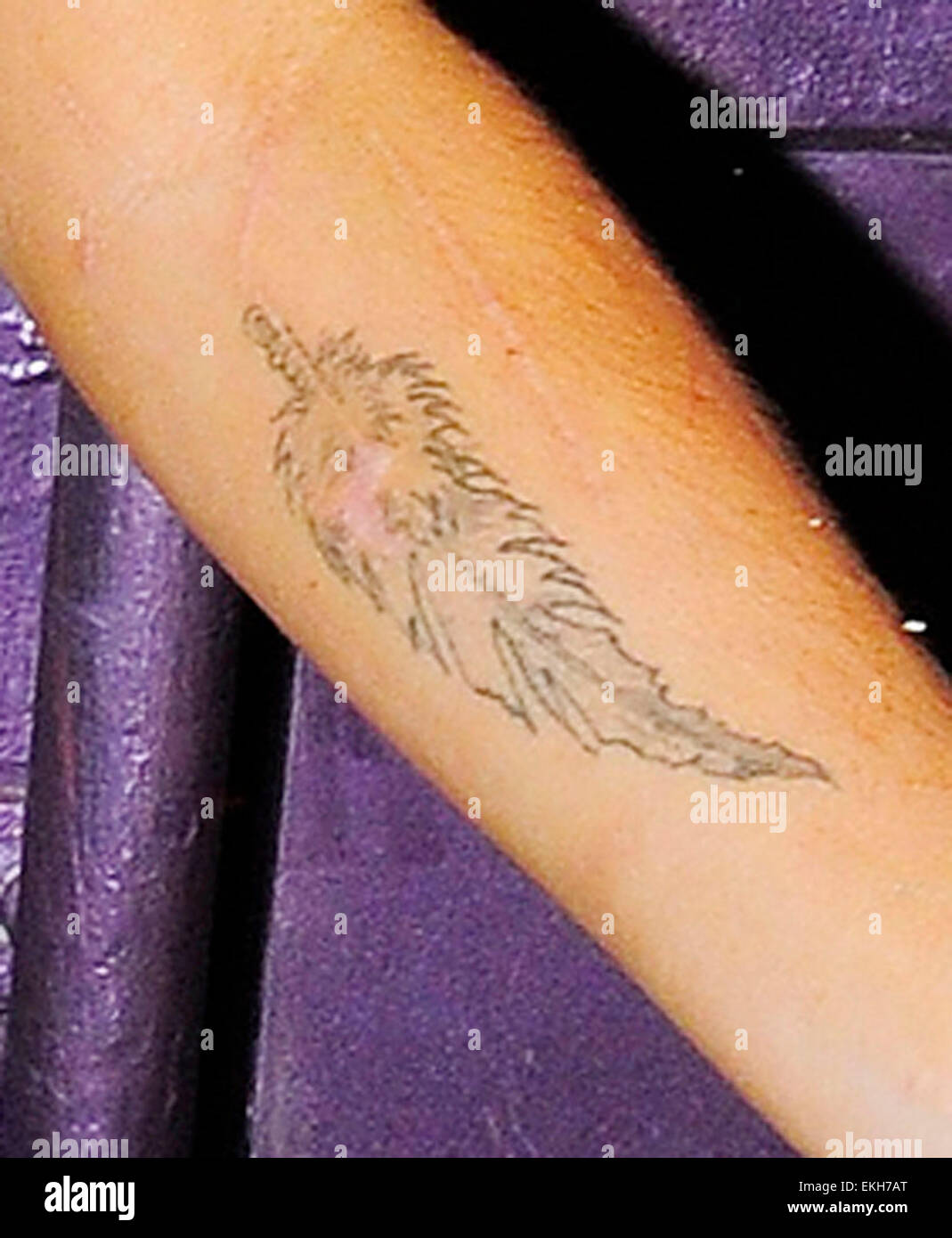 Amy winehouse feather tattoo