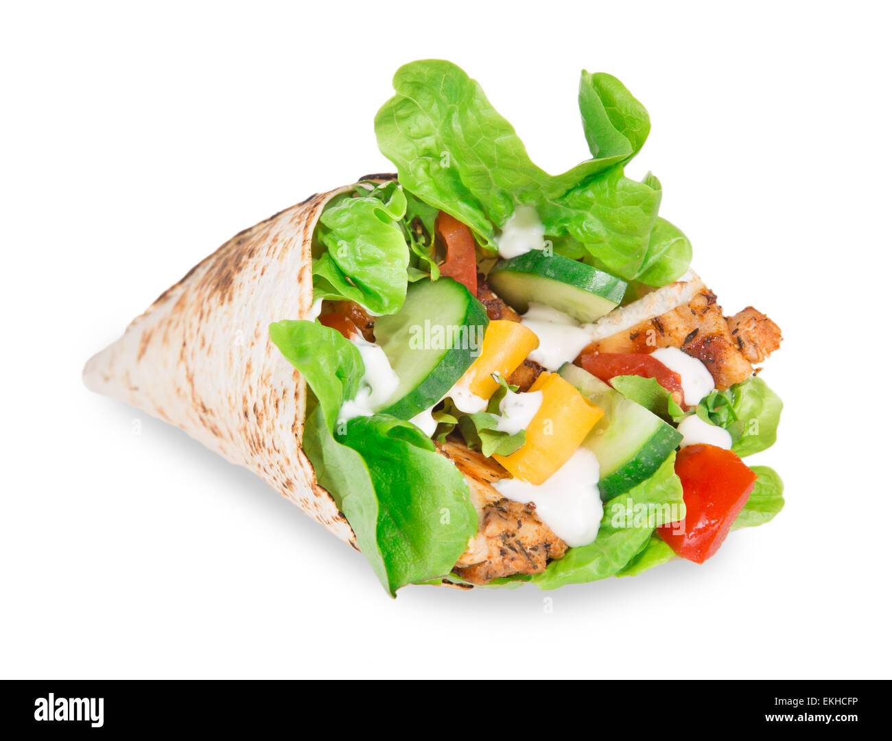Chicken slices in a Tortilla Wrap with Lettuce over white. Stock Photo