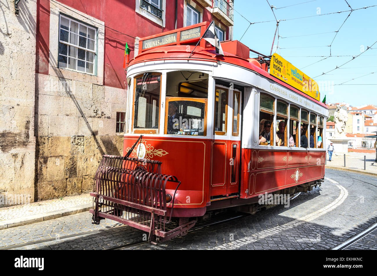 Traditional trams on medieval street of Alfama, ancient district of Lisbon, Portugal. Stock Photo