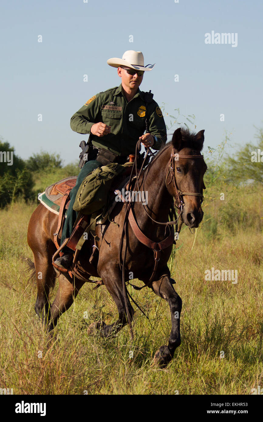 CBP, Border Patrol agents from the McAllen station horse patrol unit on patrol on horseback in