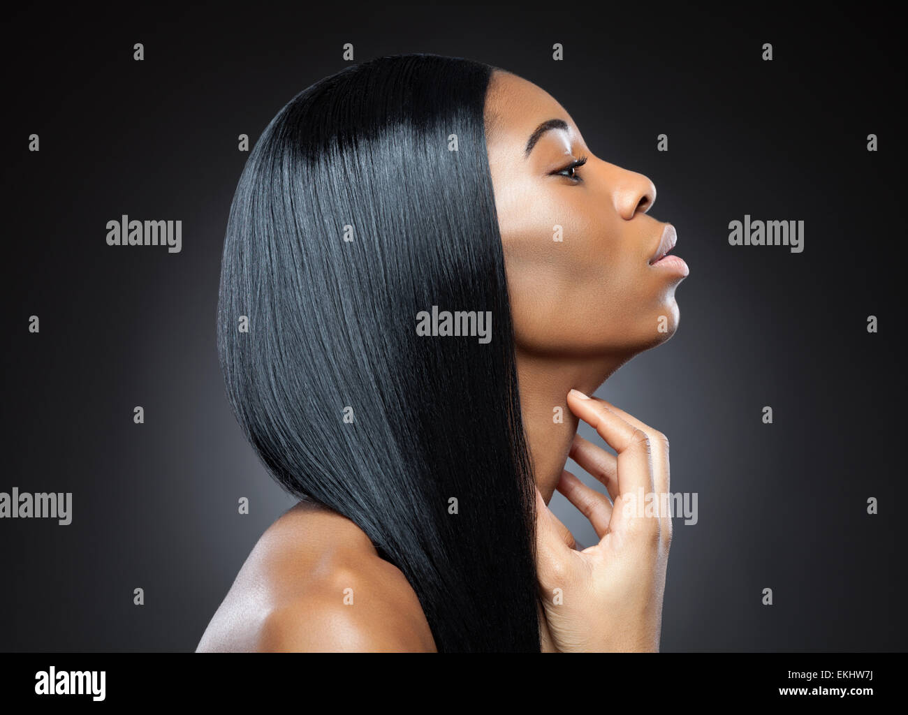 Profile of a black beauty with perfect straight and shiny hair Stock Photo
