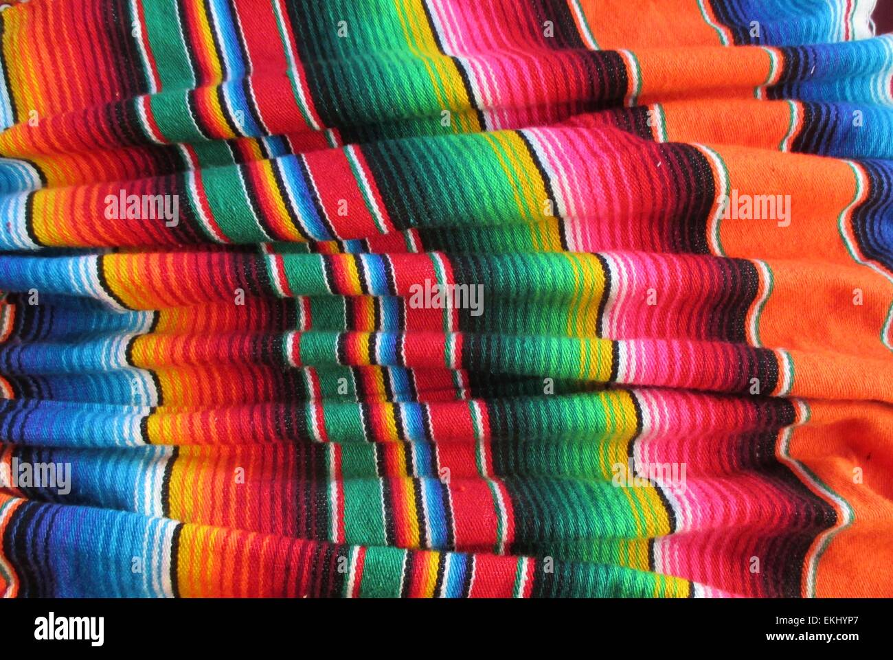 Mexican traditional handwoven rug poncho fiesta with stripes Cinco de