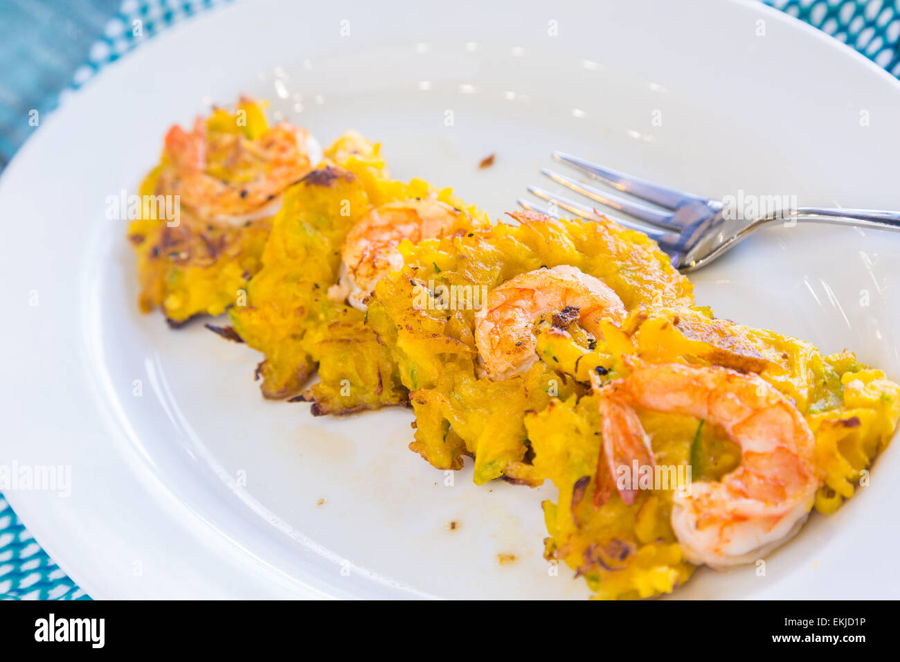 Fried patties of green papaya and kabocha topped with shrimp Stock Photo