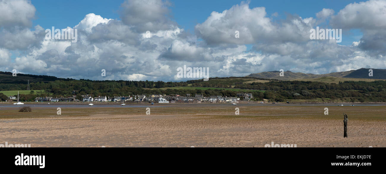 A panoramic shot of Ravenglass in Cumbria, England. The shot is taken from across the river Esk estuary at low tide. Stock Photo