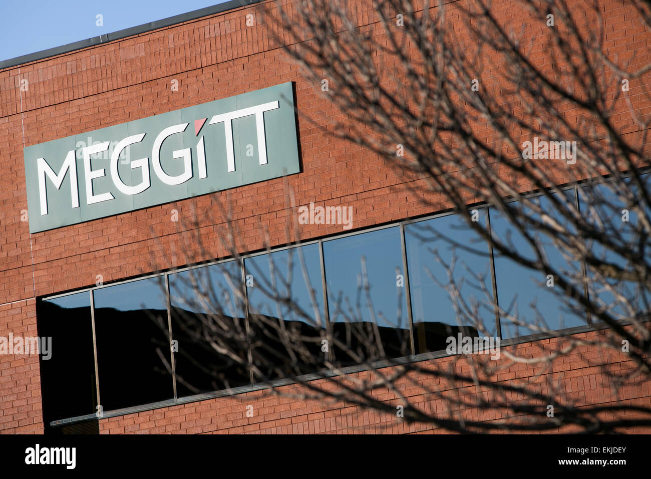 A logo sign outside outside of a building occupied by Meggitt. Stock Photo