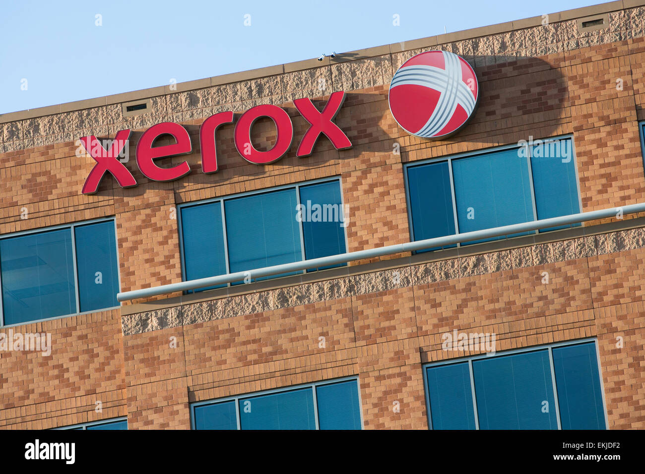 A logo sign outside outside of a building occupied by Xerox Stock Photo