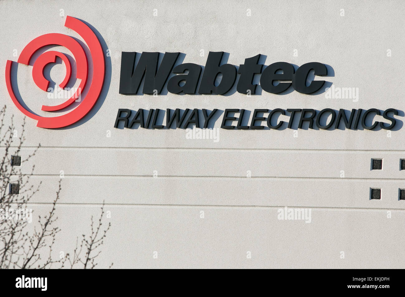A logo sign on a facility operated by Wabtec. Stock Photo
