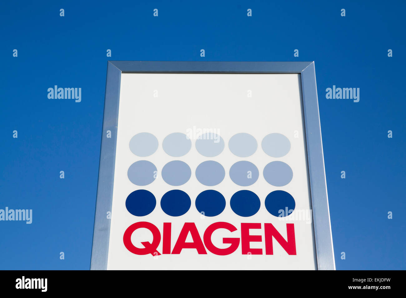 A logo sign outside of a facility operated by Qiagen. Stock Photo