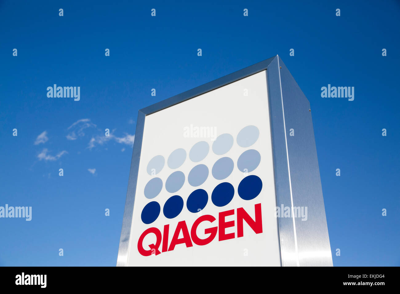A logo sign outside of a facility operated by Qiagen. Stock Photo