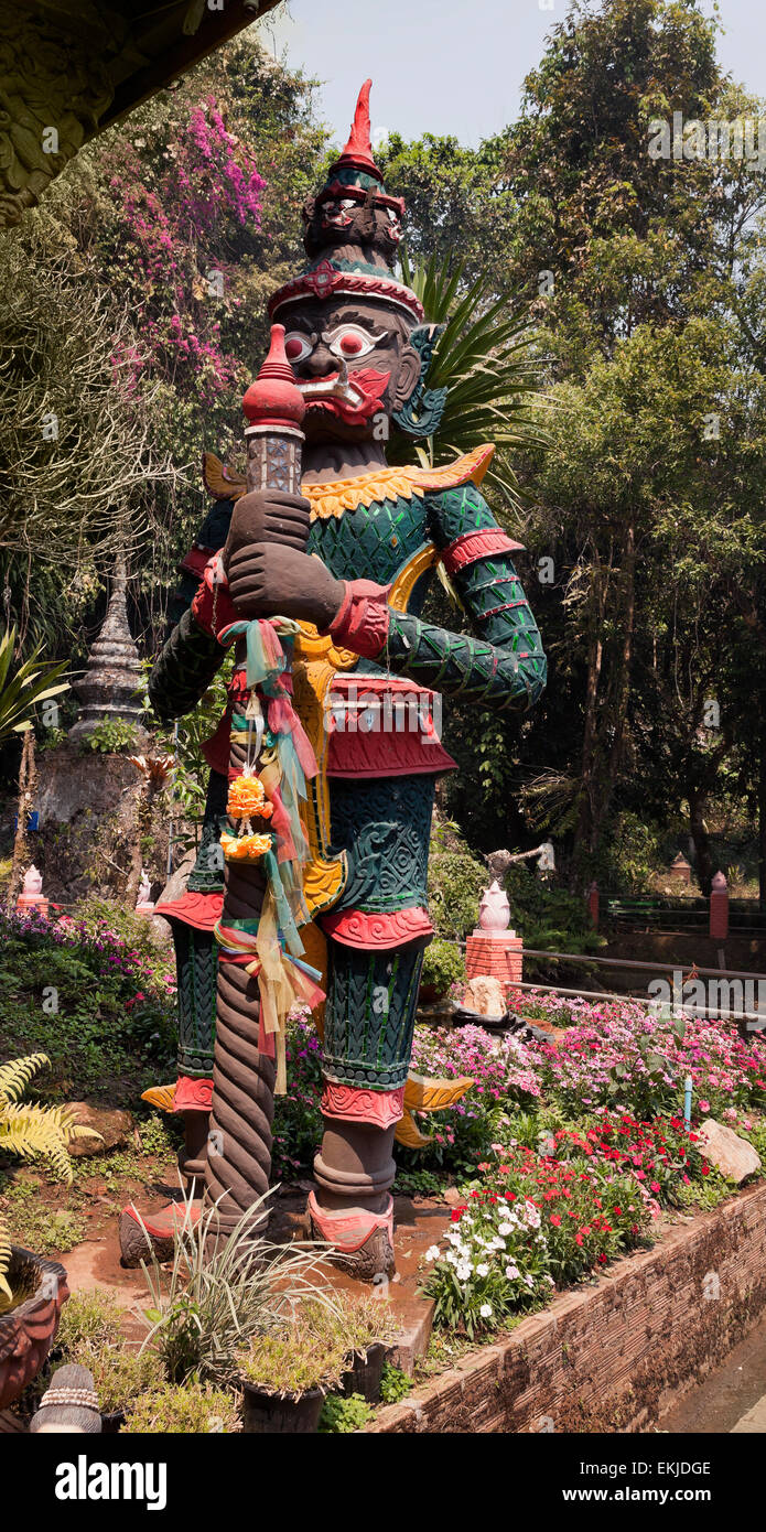 Buddhist temple Dvarapala demon guardian statue, Northern Thailand Stock Photo