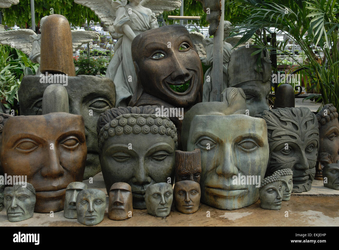 Stone Masks at Garden Center Stock Photo