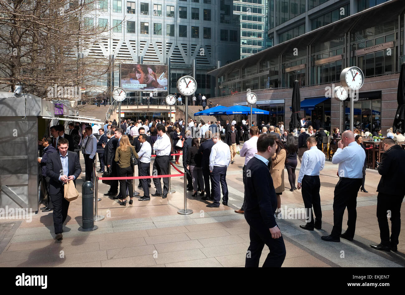 office workers standing in lunchtime queue, canary wharf, london, england Stock Photo
