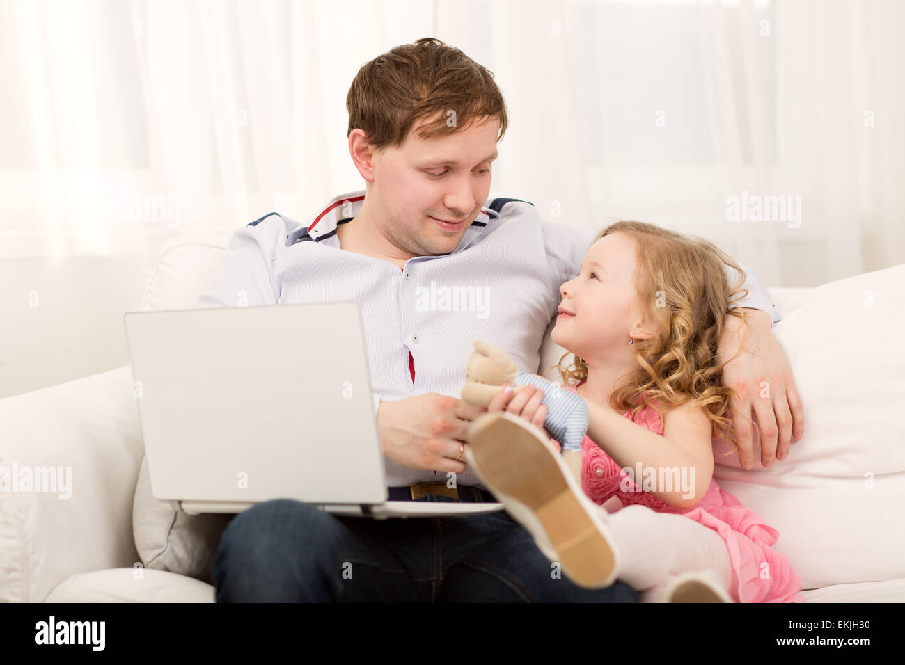 Little Girl Wants To Play With Dad Father Working With Computer But 