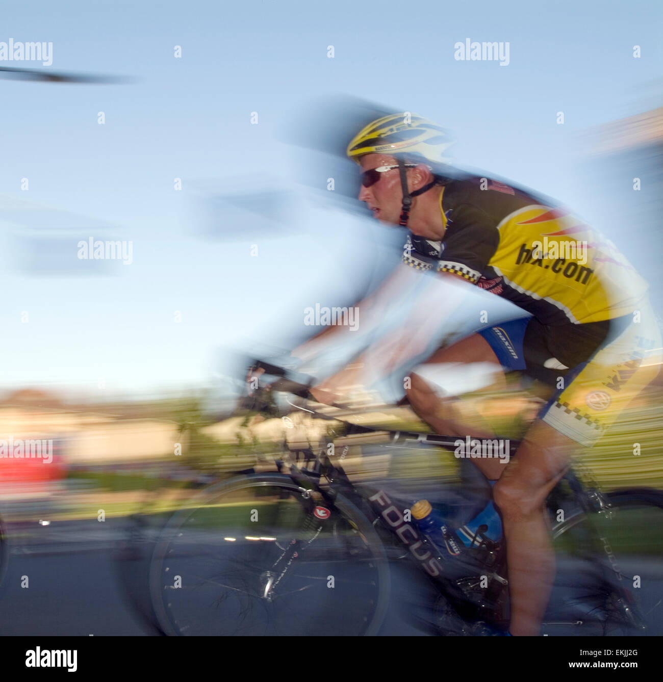 One Bicyclist blurred and flashed Stock Photo