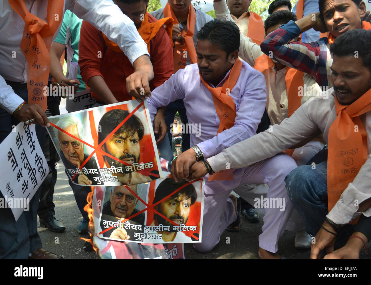 Jantar Mantar, India. 10th Apr, 2015. Hindu sena activist conducts protest & burn posters against J&K chief minister Mufti Mohammad Sayeed & the JKLF chairman Yasin Malik after their interfere in rehabilitation to Kashmiri Pandit at a separate colony at Jantar Mantar in New Delhi. © Wasim Sarvar/Pacific Press/Alamy Live News Stock Photo